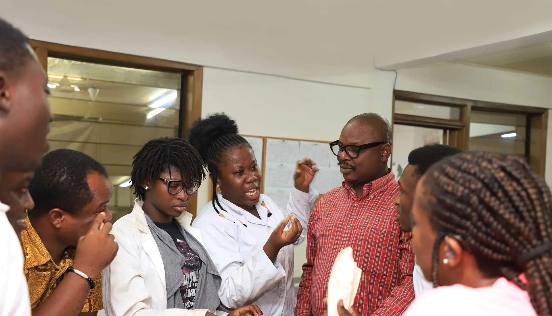Students in a practical session with a lecturer